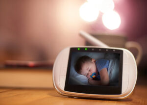 method - photo of a baby monitor with the photo of a baby sleeping on it