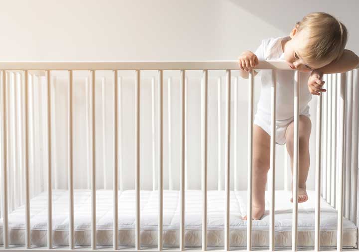 Toddler crawling out of crib